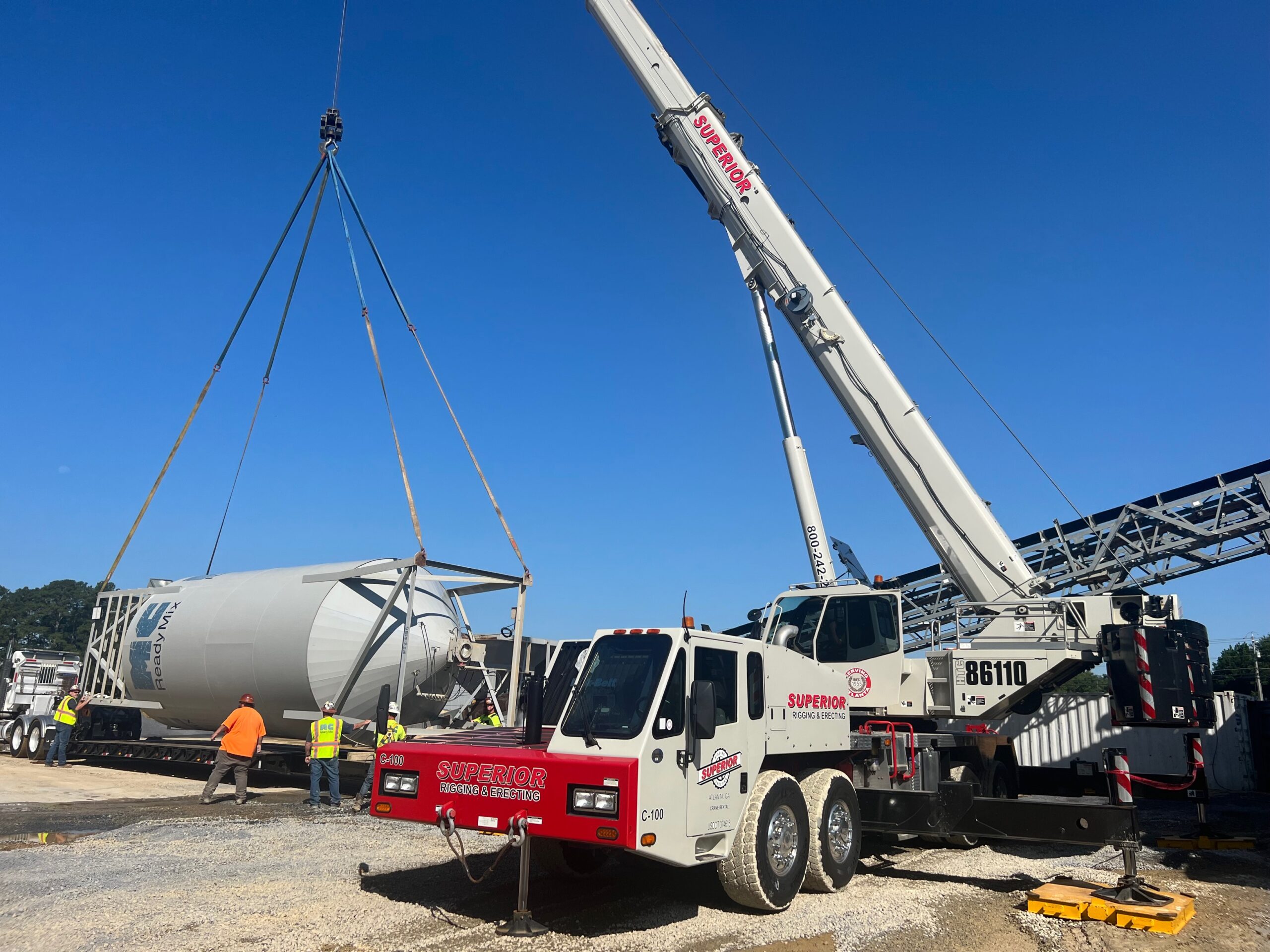 Superior Rigging truck crane lifting equipment from heavy hauler