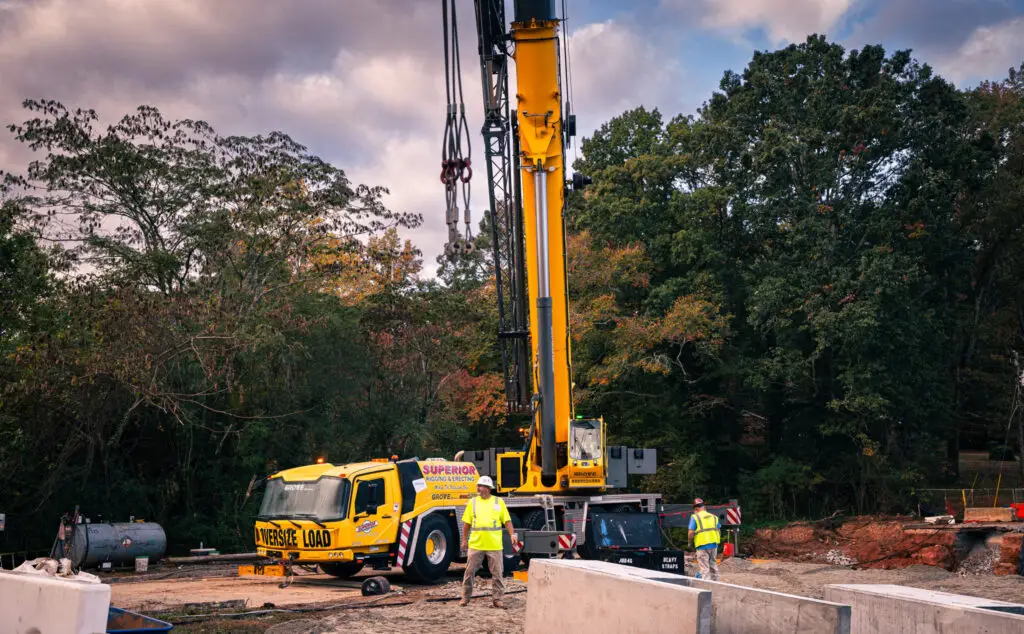 Yellow all terrain crane on a jobsite
