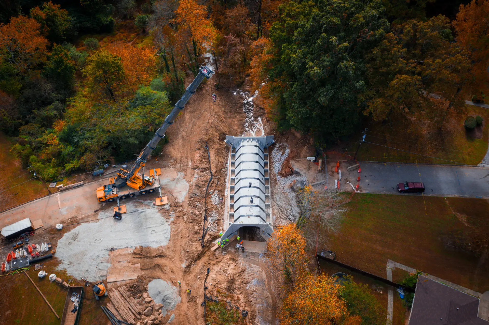 Crane setting a precast bridge in place
